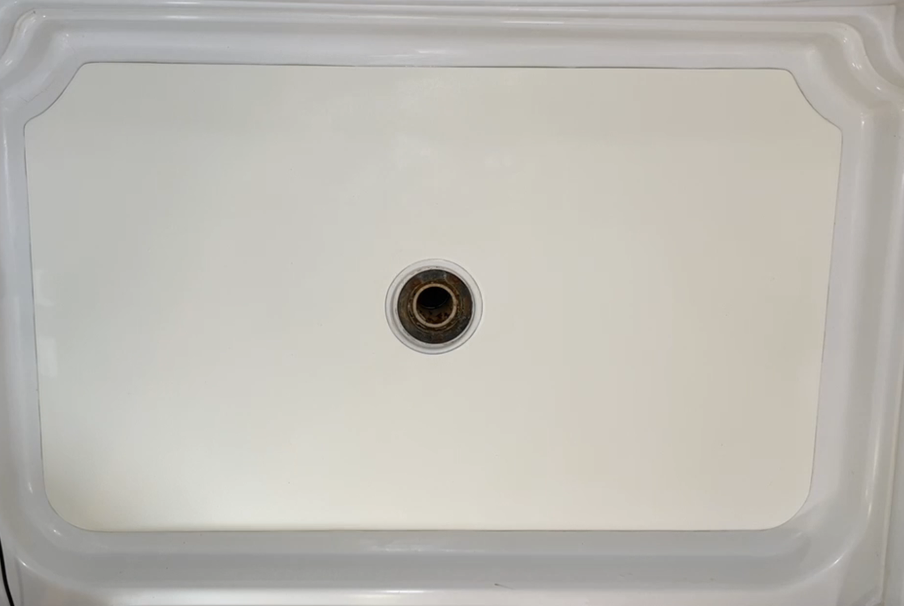 Completed completed Nu-Life shower floor inlay with centered drain