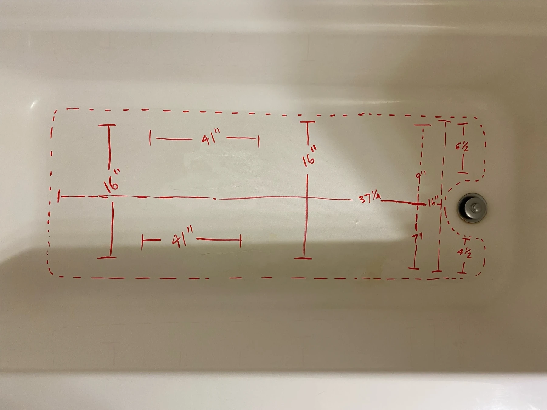 Example of flat-floor measurements marked on a bathtub for a custom Nu-Life inlay